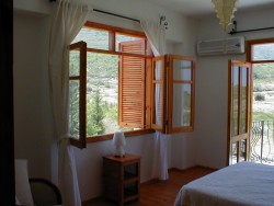 [Image: One of the villa's large bedrooms]